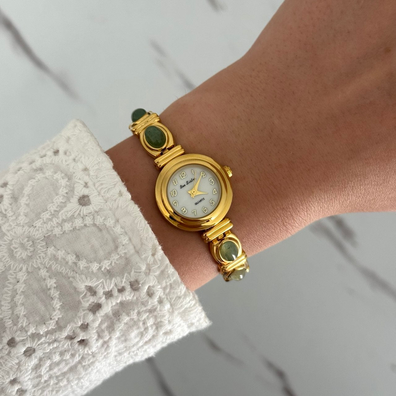 Gold Mini Watch Bracelet With Green Stones