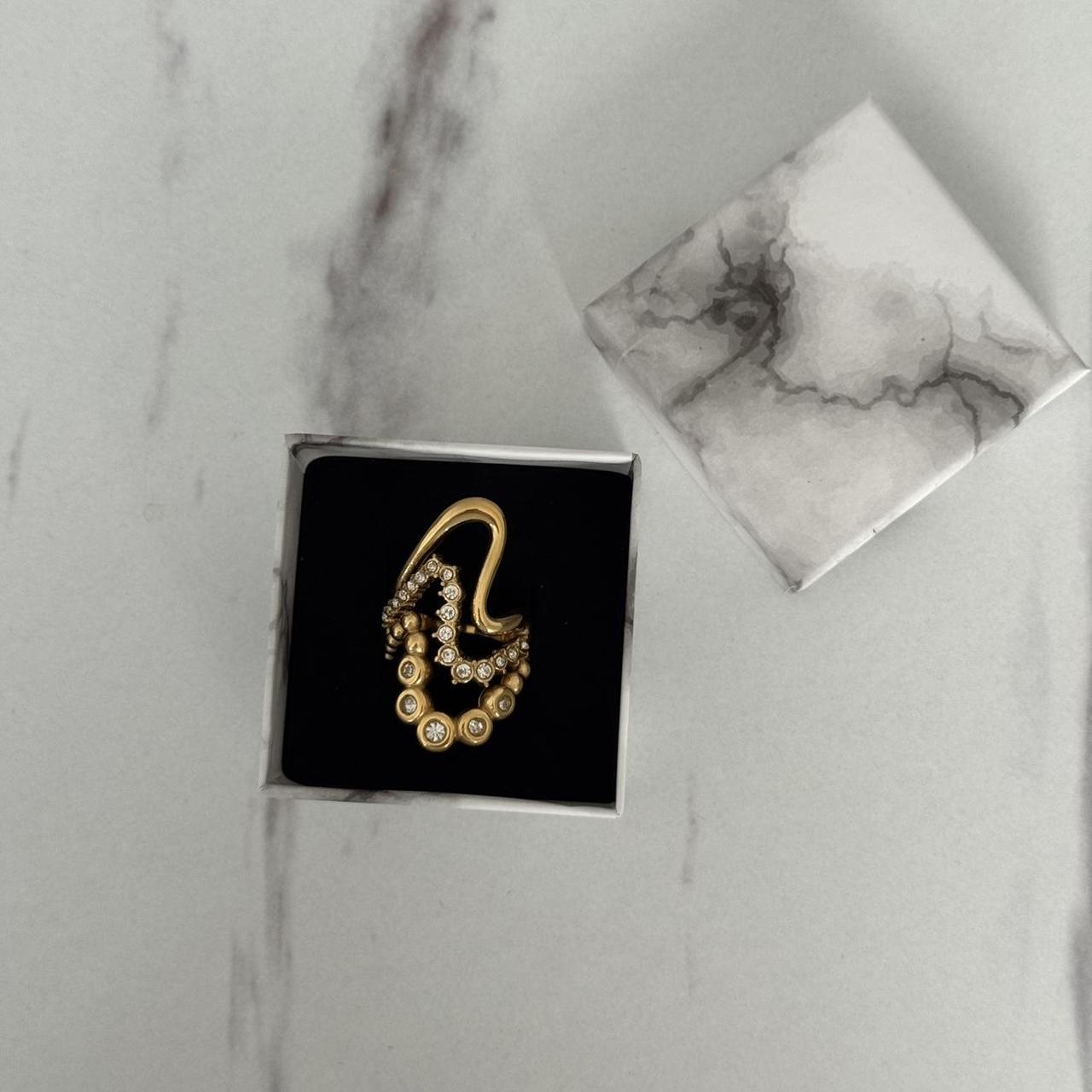 Gold ring with zircon stone