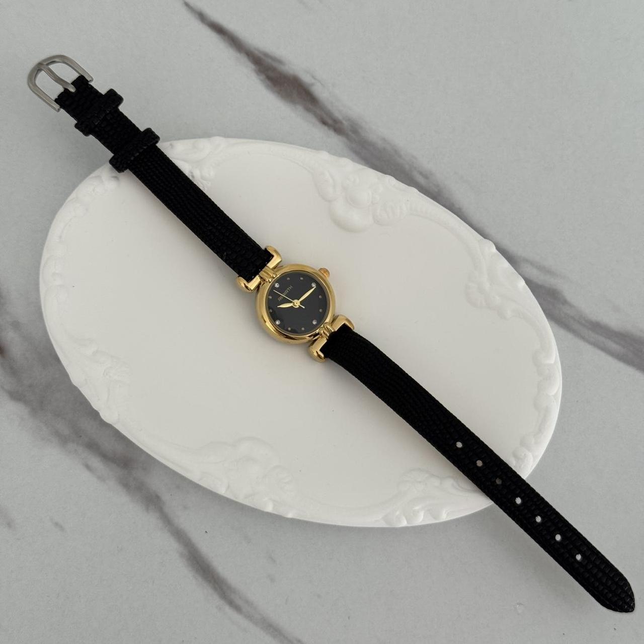 Women's Black and Gold Watch
