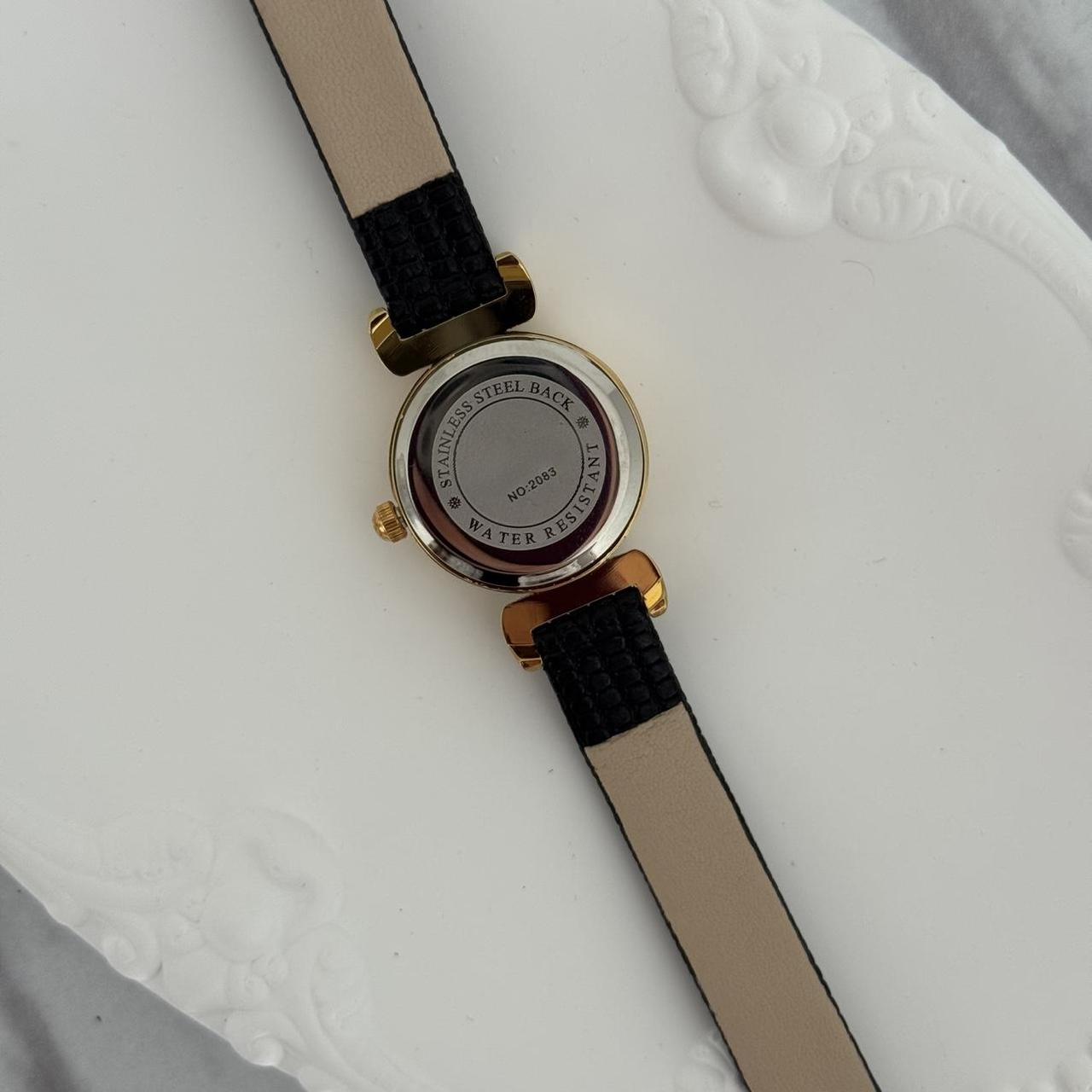 Women's Black and Gold Watch