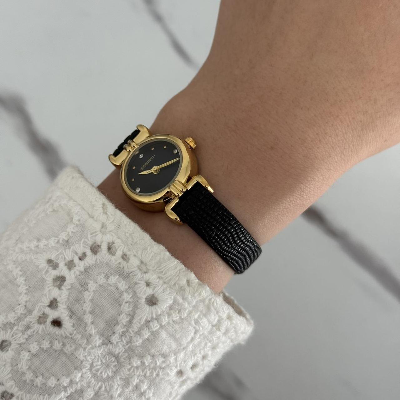 Women's Black and Gold Watch